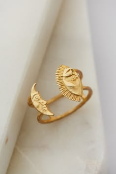 Discover the enchantment of Armenia with this exquisite Gold Plated Silver Sun & Moon Ring. A testament to Armenian artistry, this handmade statement piece beautifully fuses ancient symbolism with contemporary design. Perfect as a meaningful Mother's Day gift, it's a unique addition to any jewelry collection, connecting you with the rich tapestry of Armenian culture. Treat your loved one to a piece of history, meticulously crafted to be cherished for years to come. Adjustable Ring:  *Height: 15m Historical Jewellery Ancient Jewelry, Armenian Ring, Armenian Jewelry, Sun Ring, Armenian Culture, Moon Ring, Handcrafted Accessories, Ancient Jewelry, Stacked Jewelry