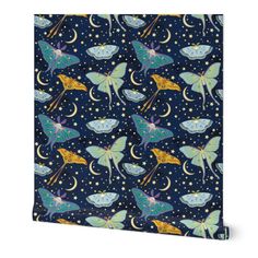 a blue and yellow butterfly print fabric with stars, moon and crescents on it