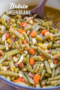 green beans and carrots are mixed together in a bowl