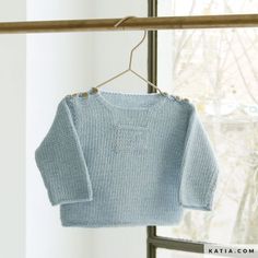 a blue sweater hanging on a clothes line