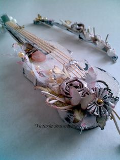 a close up of a violin with flowers on it