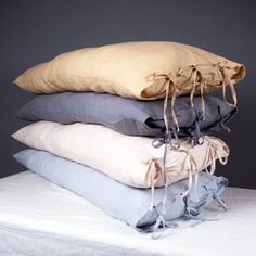 four pillows stacked on top of each other