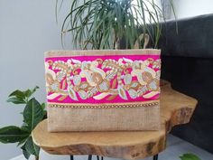 This floral clutch will bring elegance to your style. It will be chic with jeans or dresses and you may use this boho bag both day and night. This clutch wallet is perfectly handmade with high quality natural jute fabric. Designed with a silk bohemian embroidery and a tassel. Clutch has a pink silk satin interfacing and a padding inside to stand upright. Closes with a magnet closing. This bag is designed to fit all the things you need for comfortable everyday busy life. There will be enough spac Handmade Chic Clutch Evening Bag, Chic Handmade Clutch, Chic Handmade Clutch Evening Bag, Handmade Chic Clutch, Chic Rectangular Clutch As Gift, Chic Rectangular Clutch As A Gift, Chic Rectangular Clutch Perfect As A Gift, Gold Bohemian Pouch, Chic Handmade Pouch Evening Bag