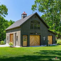 The details take this 34' x 36' Lenox Carriage Barn to a new level. Outside, herringbone garage doors and black siding catch your eye, and a light color stain applied to the interior timbers brightens the space. #thebarnyard #thebarnyardstore #postandbeambarn #postandbeam #timberframe #timberframebarn #barn #barnbuilders #exceptionallybuilt #craftedforlife #carriagebarn #lenox #lenoxcarriagebarn #modernbarn #moderndesign #tby5815 Timber Frame Shed, Barn With Living Quarters, Backyard Barn