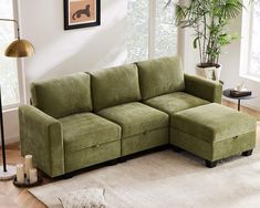 a living room with a large green couch