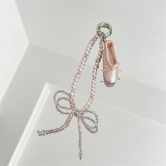 Introducing our Ballet Shoe Phone Charm--a delightful accessory that adds a touch of cute and romantic style to your phone! Crafted with care, each charm features elegant pearl beads and adorable bow-tie that complement its charming ballet shoe design. Perfect for those who appreciate femininity and elegance, these charms are more than just a phone accessory--they're a statement of individual style. Attach them to your phone for a whimsical touch or use them as a keychain to carry their charm wh Keychain Pearls, Ballet Keychain, Shoes Keychain, Coquette Ballet, Ballet Shoe, Ballet Core, Pink Coquette, Shoe Design, Romantic Style