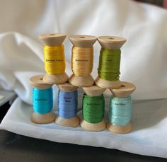 several spools of thread sitting on top of each other