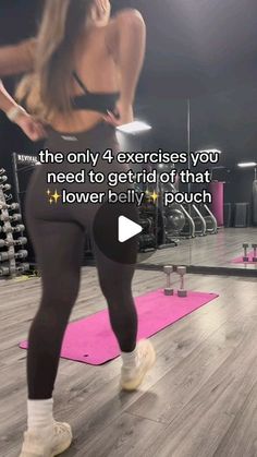 a woman standing on top of a pink yoga mat in front of a gym machine