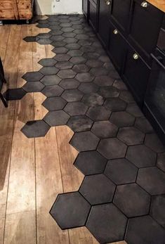 a kitchen floor with hexagonal tiles on it