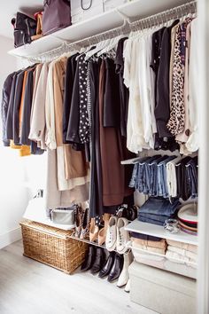 a closet filled with clothes and shoes next to a shelf full of purses on top of it