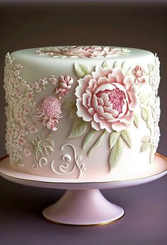 a white cake with pink flowers on it