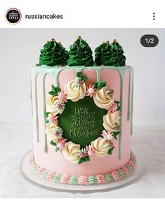 a pink and green cake with frosting on top