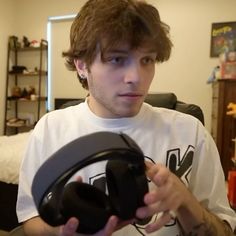 a young man holding a video game controller