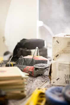 the tools are sitting on the table next to the boxes and other items that have been placed around it