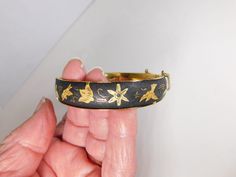 "Very nice Japanese Damascene bracelet. I believe made in Japan due to the bats  engraved on it. The older ones are made with silver and gold wire. This one has the gold wire. It is  2 3/8\" by 2 1/4\" on the inside and 1/2\" wide. It measures about 8\" on outside ." Safety Chain, Wire Bracelet, Rhinestone Brooches, Gold Wire, Old Ones, Silver And Gold, Made In Japan, Bangle Bracelets, Jewelry Bracelets