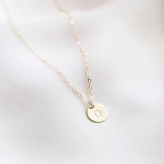 The daintiest initial necklace, available in 14k gold fill or sterling silver. It's the perfect personalized gift for anyone -- perfect as a bridesmaid necklace, friend's birthday necklace, or anyone else you love! Dainty, personal, and minimal. Find more at Simple & Dainty. Delicate Charm Necklaces For Bridesmaid Gift, Dainty Charm Necklaces With Initial Pendant For Everyday, Delicate Everyday Charm Necklace With Initial Pendant, Delicate Everyday Charm Necklaces With Initial Pendant, Simple Name Necklace With Delicate Chain, Classic Round Pendant Initial Necklace, Everyday Tiny Initial Pendant Charm Necklace, Minimalist Charm Necklace With Delicate Chain For Bridesmaids, Minimalist Delicate Chain Charm Necklace For Bridesmaids