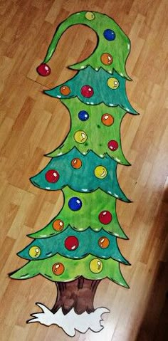 a child's drawing of a christmas tree on the floor