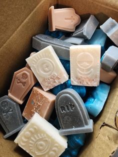 a box filled with lots of different colored soaps