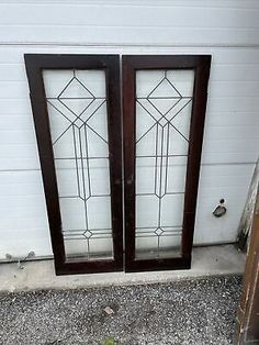 two stained glass doors sitting next to each other