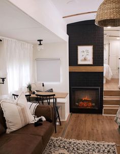 a living room filled with furniture and a fire place