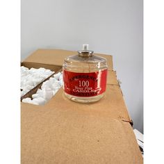 a candle sitting on top of a cardboard box