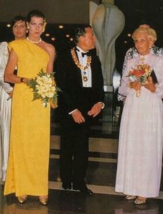 an older couple and two younger women in formal wear