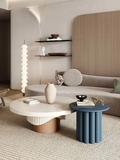 a living room filled with furniture next to a wall mounted shelf above a coffee table