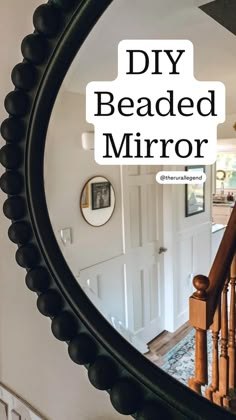 a mirror that has the words diy beaded mirror on it in front of a staircase