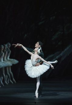 two ballerinas in white tutus and black leor