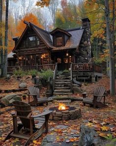 a log cabin in the woods surrounded by fall leaves and fire pit with chairs around it