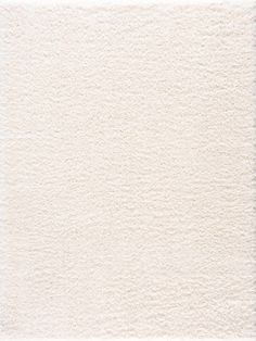 a white area rug with small circles on the top and bottom, in various sizes