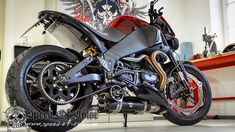 a motorcycle parked in a garage next to a shelf