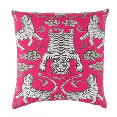 a pink pillow with white and black tiger designs on the front, sitting on a white background