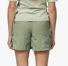 These heritage-inspired shorts are made of 95% nylon (65% recycled)/5% spandex with a DWR (durable water repellent) finish. Inseam is 4in. Made of durable 95% nylon (65% recycled)/5% spandex with a DWR (durable water repellent) finish that sheds light moisture Elasticized waistband with grosgrain tab for an adjustable fit Back yoke for a flattering fit Two slash front pockets secure with zippers Two drop-in side pockets with snap closures Mid rise Inseam is 4in Fit Back, Fit Details, Fabric Details, Patagonia Womens, Outdoor Woman, Pocket Detail, Patagonia, Repellent, Water Repellent