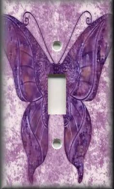 a purple butterfly light switch plate cover