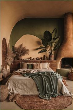 a bedroom with a large bed covered in blankets and pillows next to a fire place