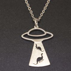 If you believe aliens exist million of years ago, this necklace is for you and you're a true UFO enthusiast. Base Material: 925 Sterling Silver  Size: 22mm X 29mm Chain Length: 16'' - 24'' Inches (Selectable) Metal Stamped: 925 Thickness: 1.5mm / 0.059 Inch You'll receive Order Shipped Email from us when your item is completed and shipped. SPECIAL ANNOUNCEMENT  1. Please visit https://www.etsy.com/shop/yhtanaff for more designs. 2. Subscribe our newsletter to receive a Coupon Code for 10% discou Silver Space-themed Jewelry Gift, Space-themed Sterling Silver Jewelry Gift, Themed Sterling Silver Nickel Free Necklaces, Themed Sterling Silver Nickel-free Necklace, Themed Sterling Silver Necklace In Silver, Themed Sterling Silver Necklace, Adjustable Themed Sterling Silver Necklace, Sterling Silver Novelty Necklace For Gift, Themed Sterling Silver Jewelry As Gift