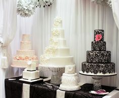 a table topped with lots of different types of cakes