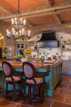 a large kitchen with an island and lots of counter space