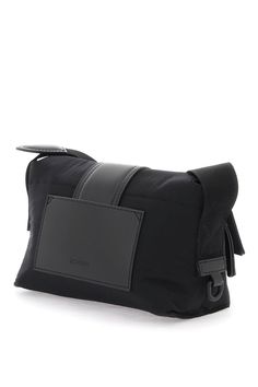 High-quality material blend featuring 100% Polyamide, 100% Cotton, and premium leather accents Compact and stylish with dimensions 21cm W x 14cm H x 10cm D Designed for sophisticated modern men Ideal for fall/winter season, perfect for FW24 collection Sleek black design, versatile for professional and casual settings A trendy shoulder bag tagged under: Bags, Shoulder Bags, Men's Fashion Accessories Jacquemus Bag, Mini Messenger Bag, Nylon Shoulder Bag, Leather Pocket, Leather Cap, Mini Shoulder Bag, Metal Logo, Mens Accessories Fashion, Metallic Logo