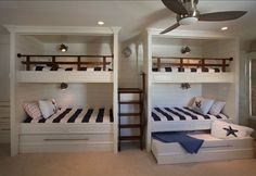 there are bunk beds in the room with blue and white bedding