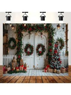 a christmas scene with wreaths and presents on the wall next to a white door