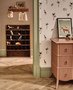 a room with wooden floors and wallpaper