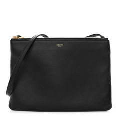 This is an authentic CELINE Lambskin Large Trio Crossbody Bag. This shoulder bag is crafted with supple black lambskin and features an adjustable crossbody strap, gold-tone hardware, and three compartments that unzip to a soft fabric interior. Celine Trio Bag, Celine Trio, Crossbody Bag Black, Black Cross Body Bag, Crossbody Strap, Large Bags, Soft Fabric, Soft Fabrics, Crossbody Bag