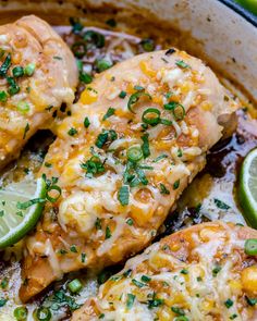 chicken enchilada in a skillet with limes and cilantro