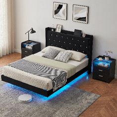 a bed with blue lights on it in a room