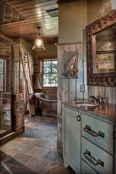 a bathroom with a tub, sink and shower in the middle of it's walls