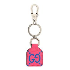 a keychain with the word go on it and a tag attached to it