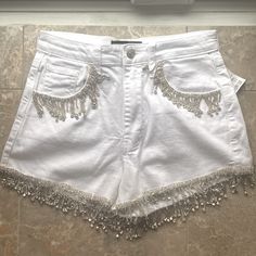 White Jean Denim Shorts With Rhinestone Fringe. New With Tags Size Small Summer Party Jeans With Rhinestones, Summer Party Embellished Jeans, High Waist Rhinestone Jean Shorts For Party, High-waist Rhinestone Jean Shorts For Party, Fitted Summer Jeans With Rhinestones, Summer Fitted Jeans With Rhinestones, Fitted Rhinestone Jeans For Summer, Embellished Cotton Bottoms For Summer, Summer Embellished Cotton Jeans