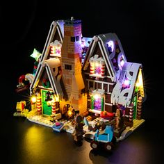 a lego lit up house with lights on it